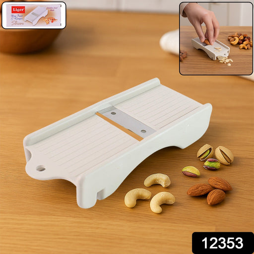 Close-up of dry fruit slicer cutting fresh ginger precisely