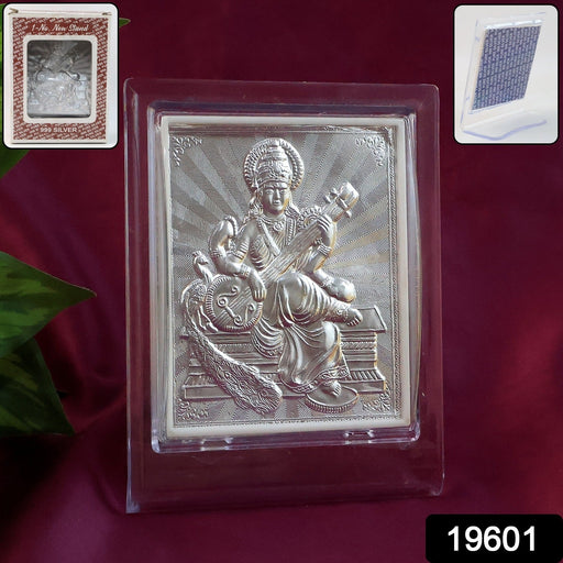 Close-up of embossed Goddess Saraswati detail on silver photo frame