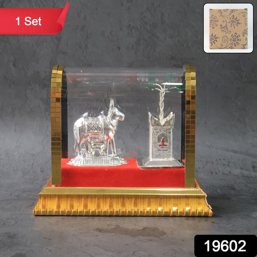 Sacred Kamdhenu cow and calf silver-plated idol with red velvet base