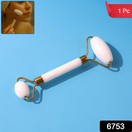 Close-up of the cooling stone facial massage roller for enhanced serum absorption.
