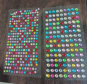 Display of multi-size self adhesive crystals for diverse art and craft projects.