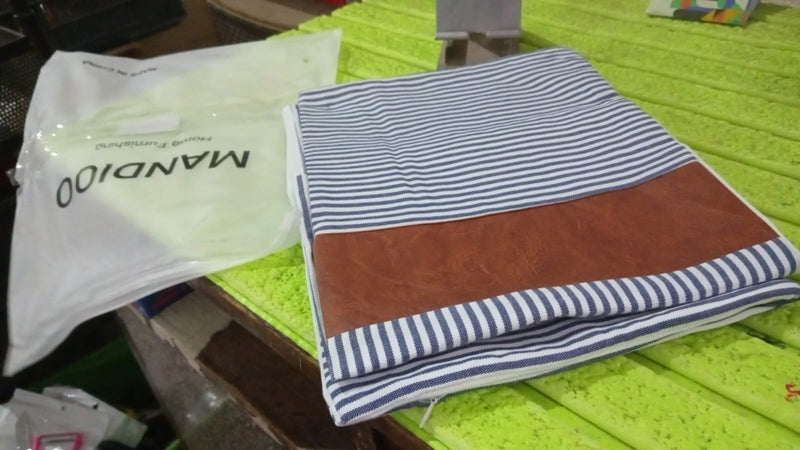 Stack of two stylish leather and cotton pillow covers for home decor