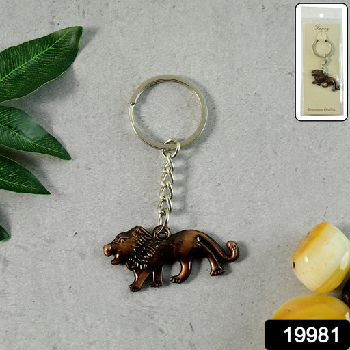 Close-up of the intricate walking lion design on metal keychain