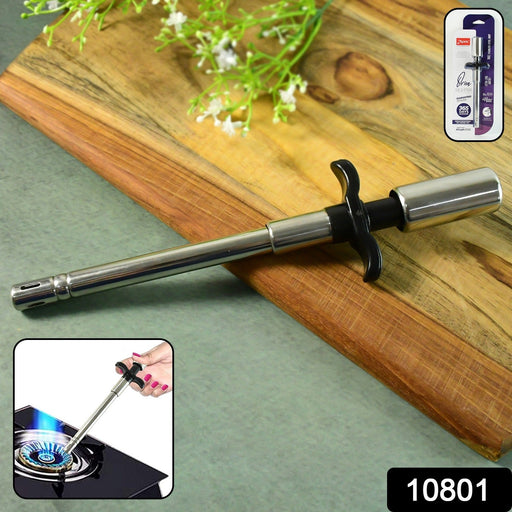 Gas stove lighter being held safely over a gas burner for ignition