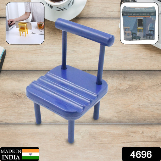A smartphone resting comfortably in the wooden Mini Chair Phone Stand on a light-colored surface.