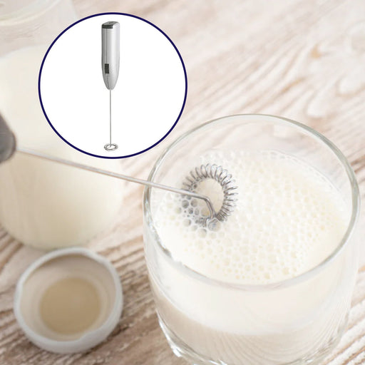 Electric milk frother with whisk attachment, ready for use.