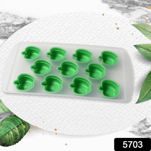 Assortment of vibrant fruit-shaped ice cubes in a glass.