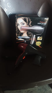 Calm & Curl professional hair dryer showcasing power and user comfort