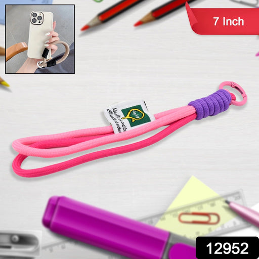 Person holding a mobile phone secured with a vibrant multi-color hand wrist strap.