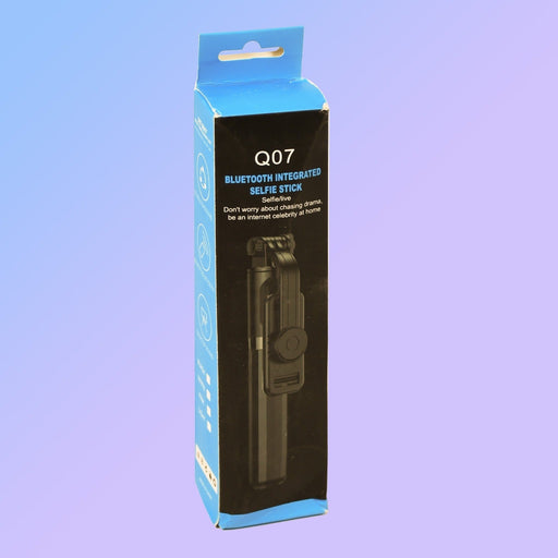 Bluetooth selfie stick extended as a phone tripod for stable shots.