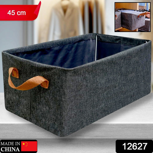 Foldable storage box holding neatly folded clothes, demonstrating practical closet organization.