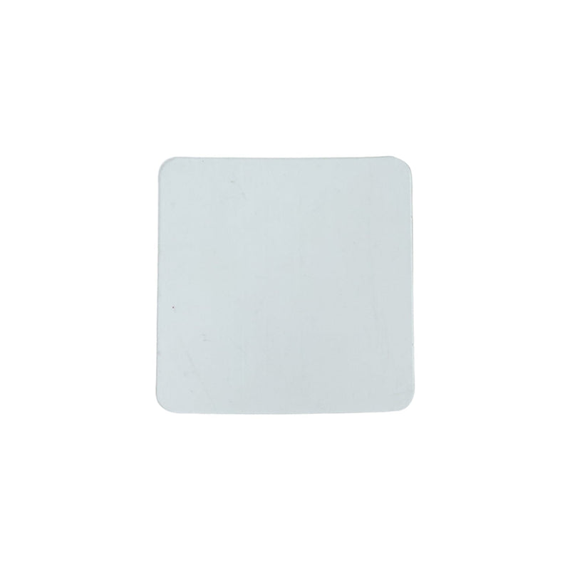 Flat lay of transparent square nano adhesive tape pads