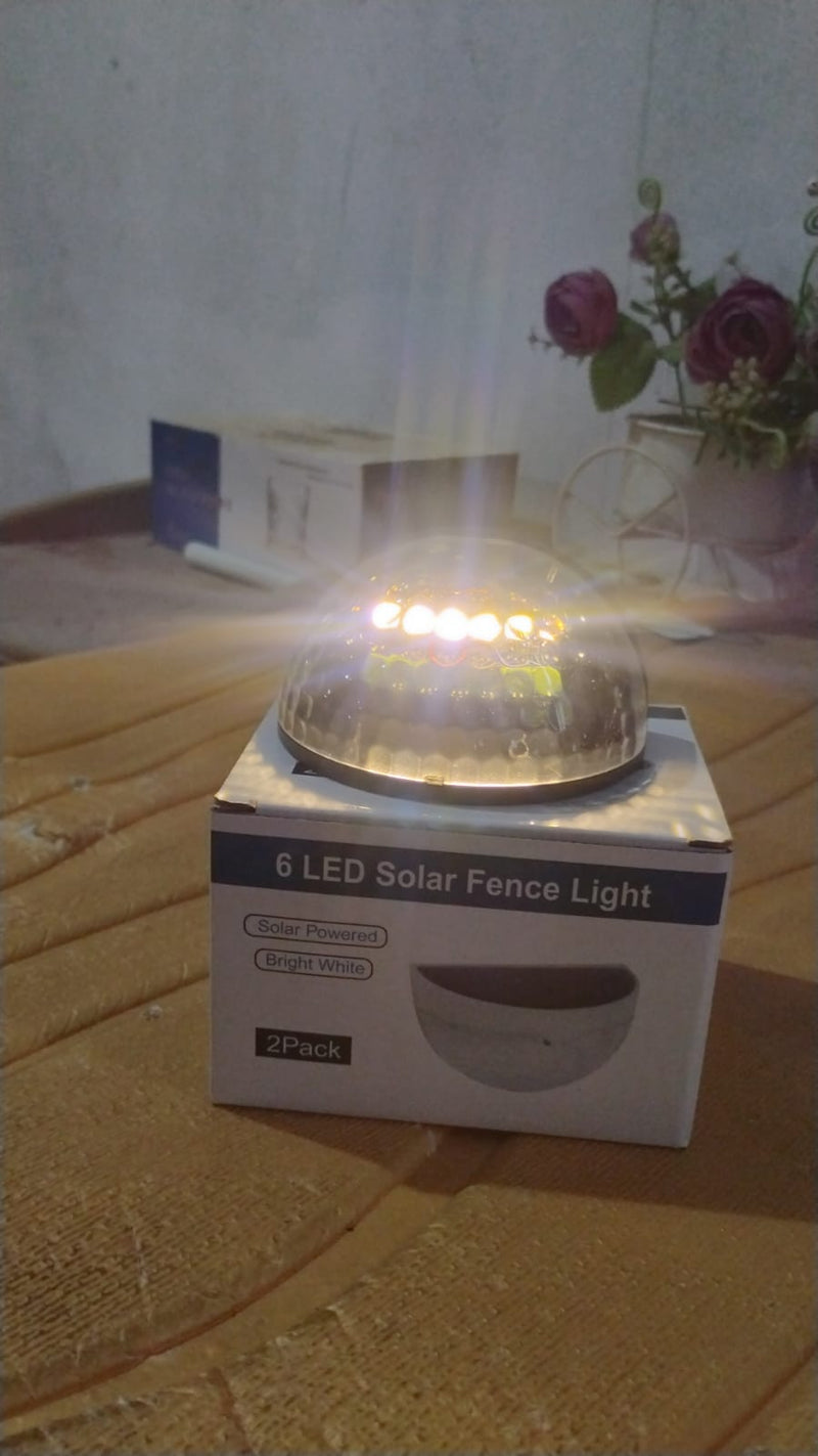 Solar LED wall mount fence light attached on outdoor wall