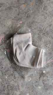 Instructional image showing how to wear the heel socks for best results.