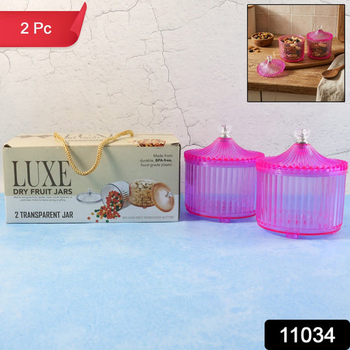 Transparent dry fruit storage jar on kitchen counter showcasing snacks