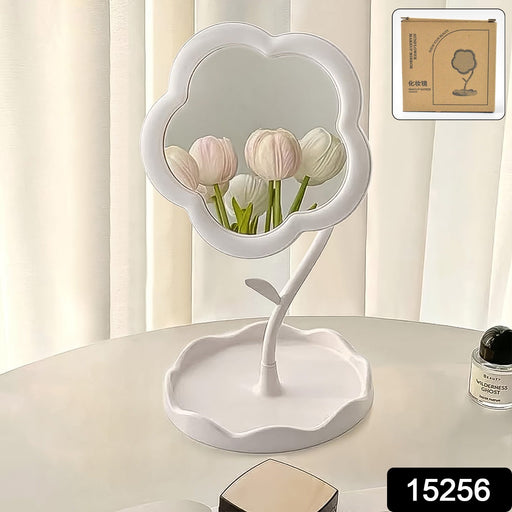 Side view of rotatable flower vanity mirror sitting on a tabletop