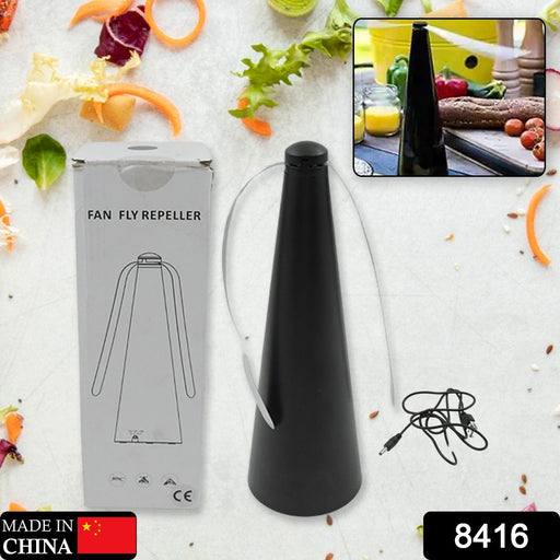 Tabletop fly repellent fan in use, keeping food safe from pests.