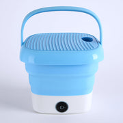 Mini folding washer on a clean background, highlighting its compact size for travel.