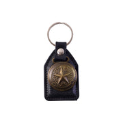 Metal star emblem keychain attached to a keyring for car keys