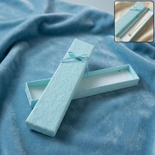 Premium long jewelry gift box closed with ribbon for gifting