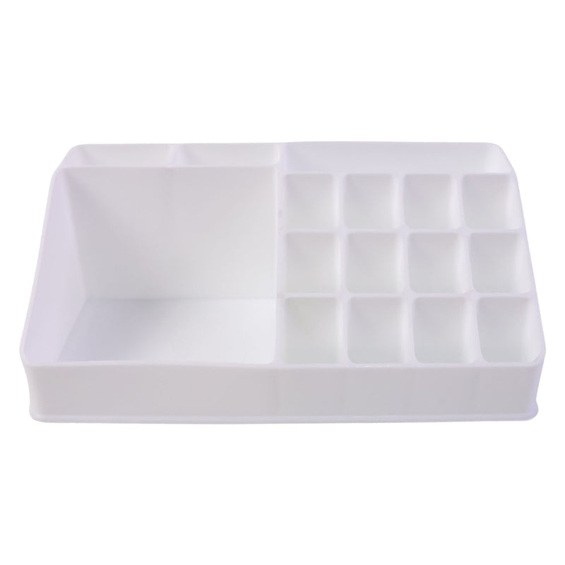 Pull-out drawer of the clear makeup organiser holding compacts and small items.