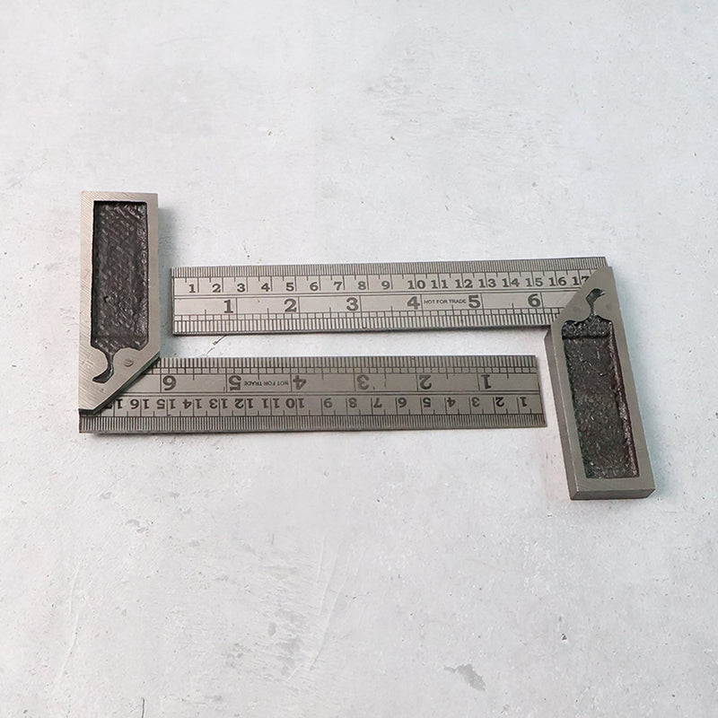 Two-piece metal try square ruler set showing accurate etched inch and centimeter measurements