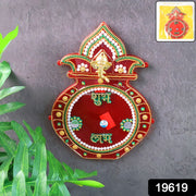 Close-up of decorative wooden Kalash wall hanging with stone and pearl accents