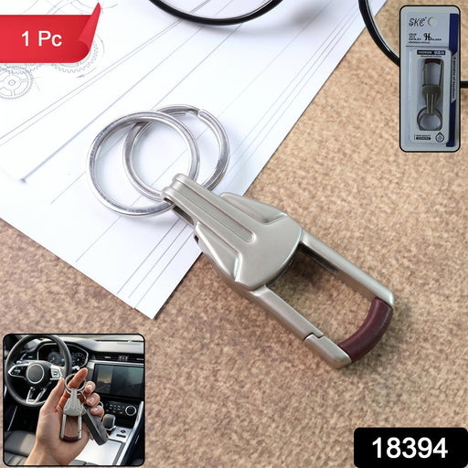 Close-up of durable metal alloy key holder with dual key rings and locking clip