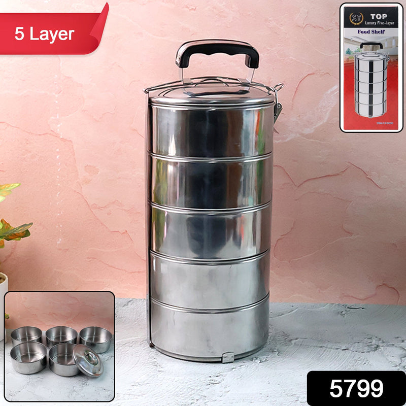Overhead view of the five distinct compartments inside the tiffin box.