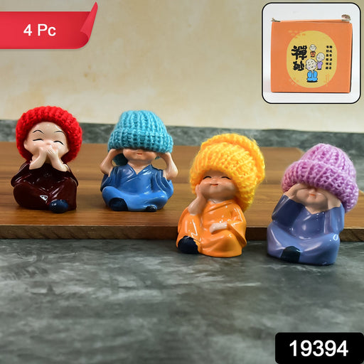 Set of four resin monk Buddha figurines in vibrant robes with straw hats for spiritual home décor
