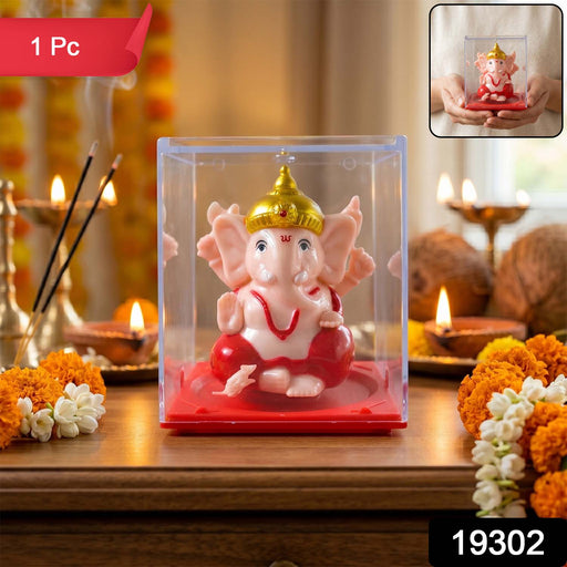 Side view of small decorative Ganesha idol showing hand movement feature