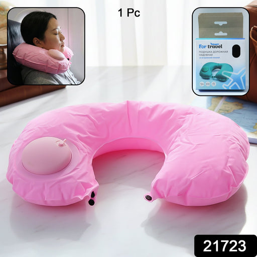 Person using inflatable travel neck pillow on airplane for neck support