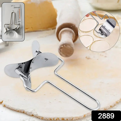 Close-up of the puri cutter roller blades precisely cutting dough circles.