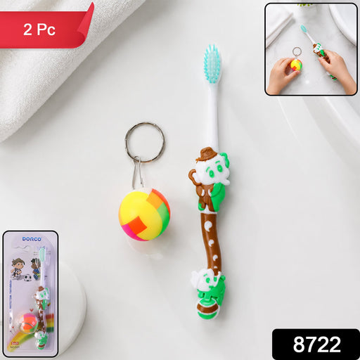 Close-up of colorful kids toothbrush with soft bristles and small toy ball