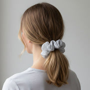 Close-up of hair tie made from dual-tone satin and mesh fabric
