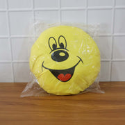 Smiley face plush pillow cushion in a colorful kids’ room setting