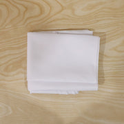 Round white table cover on a table for everyday use